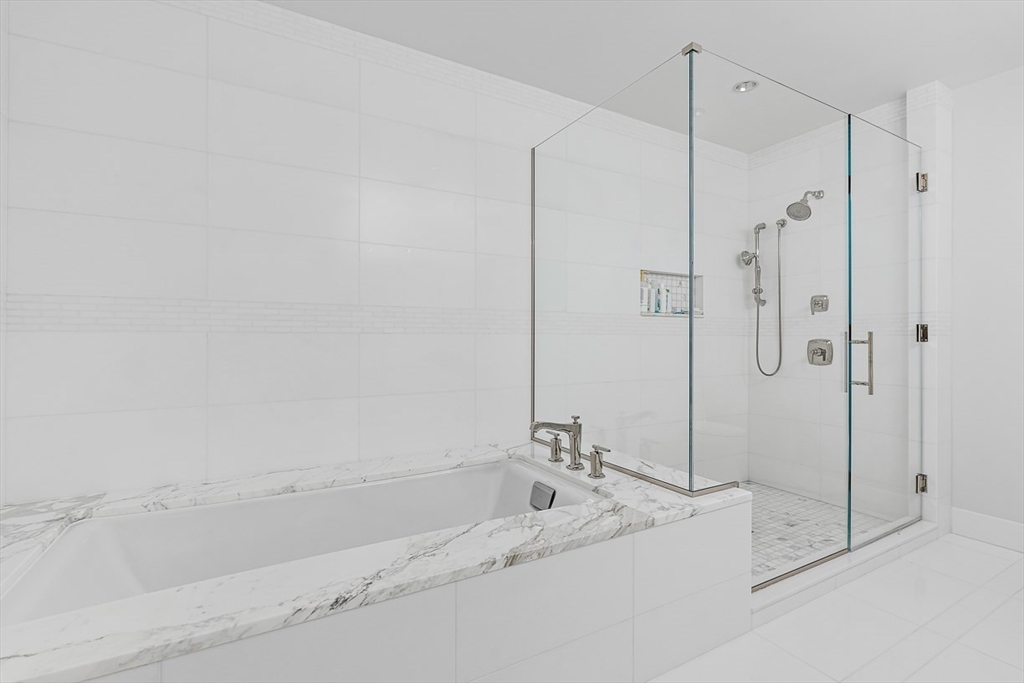22 Liberty Drive, Unit 4D Boston, MA 02210 - Photo 14 of 21 a bathroom with a bathtub and a shower
