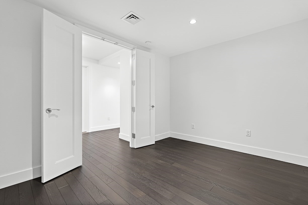 22 Liberty Drive, Unit 4D Boston, MA 02210 - Photo 16 of 21 a view of wooden floor in an empty room