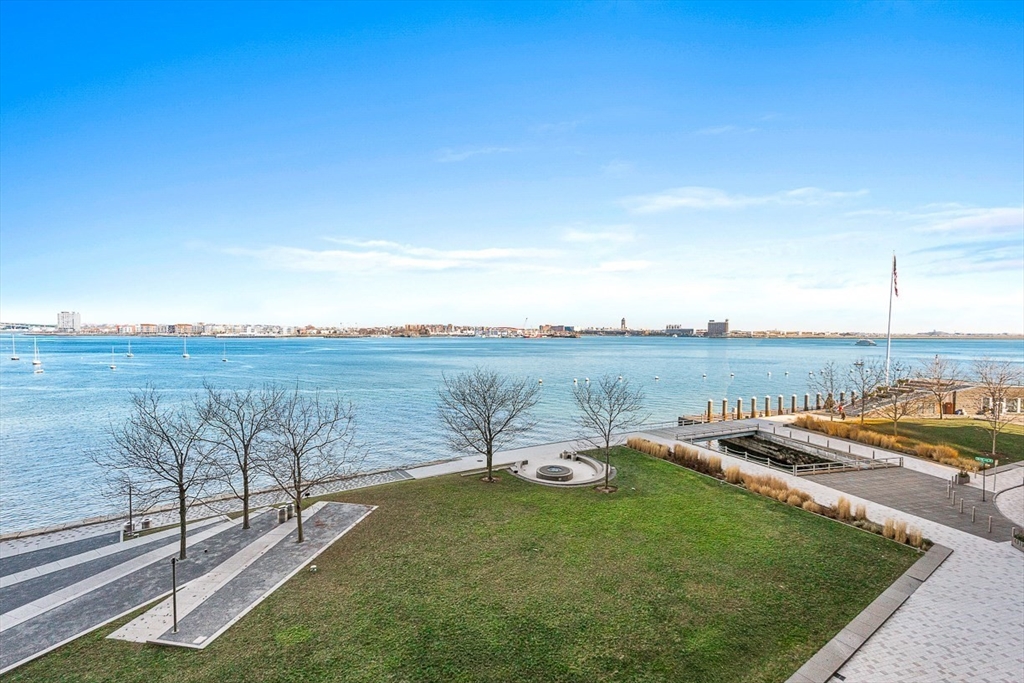 22 Liberty Drive, Unit 4D Boston, MA 02210 - Photo 4 of 21 a view of a lake with table and chairs