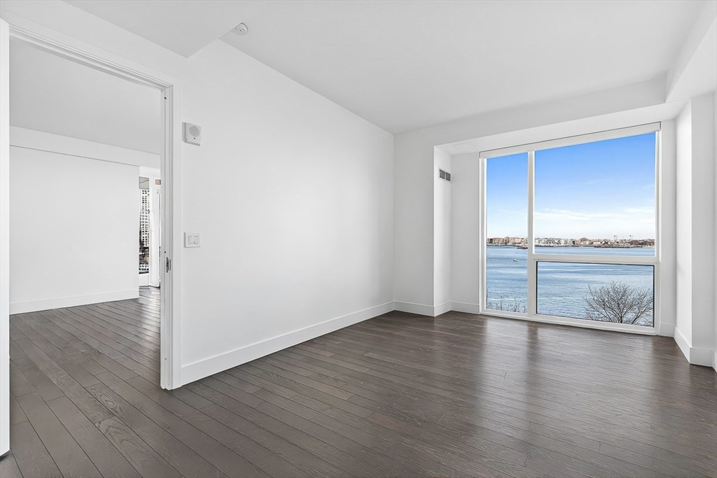 22 Liberty Drive, Unit 4D Boston, MA 02210 - Photo 10 of 21 a view of an empty room with wooden floor