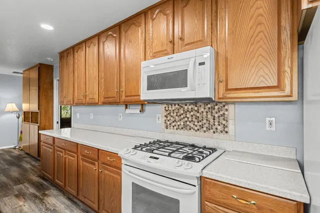 a view of a sink and a large mirror