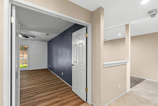 a bedroom with a large bed and a large window