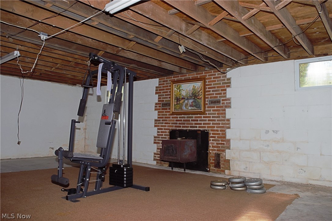 1128 Brownville Road Rome, OH 44085 - Photo 19 of 34 Full basement offer wood stove for added heat source.
