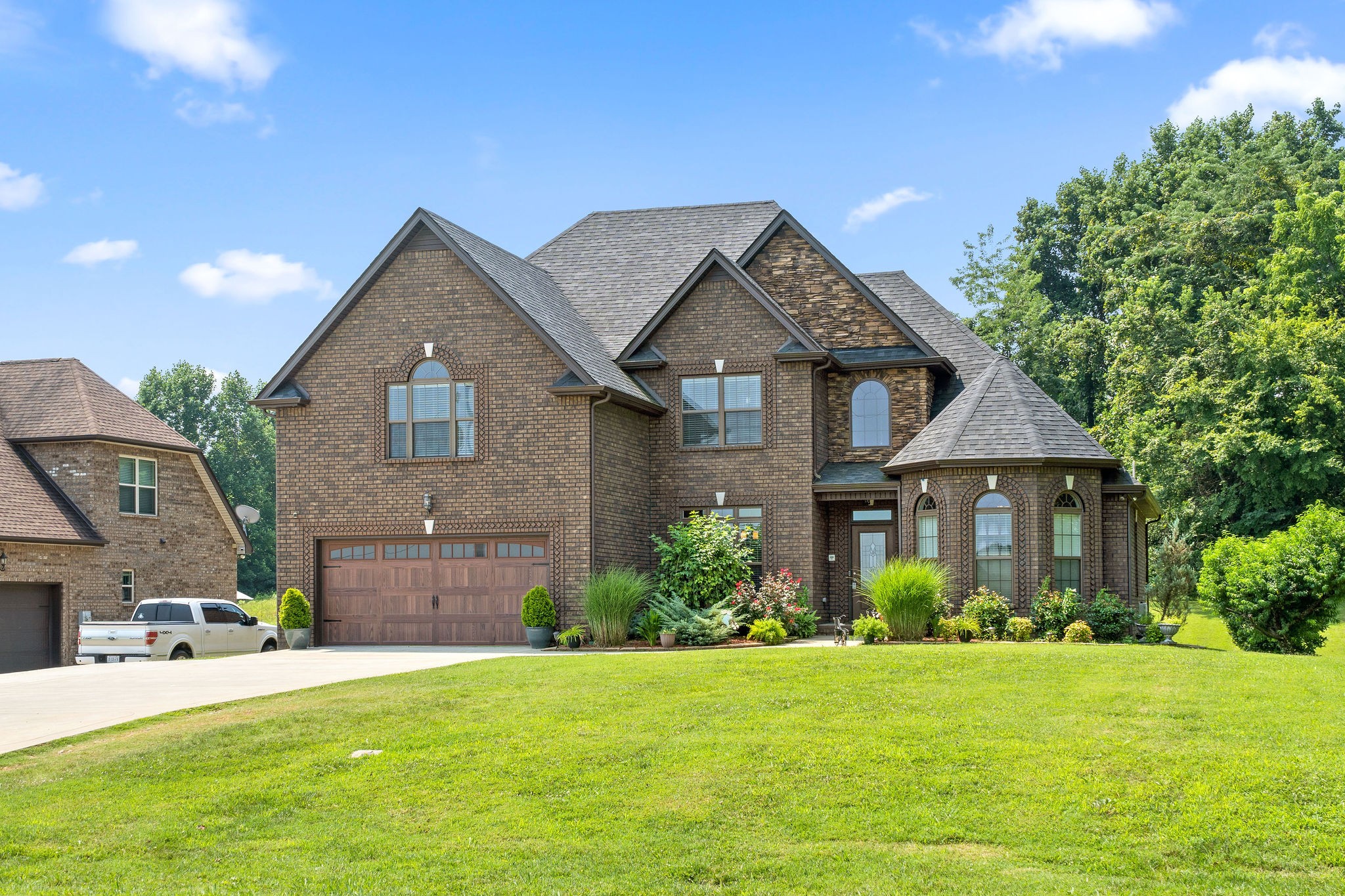 3508 Drake Road Adams, TN 37010 - Photo 2 of 35 a front view of a house with a garden