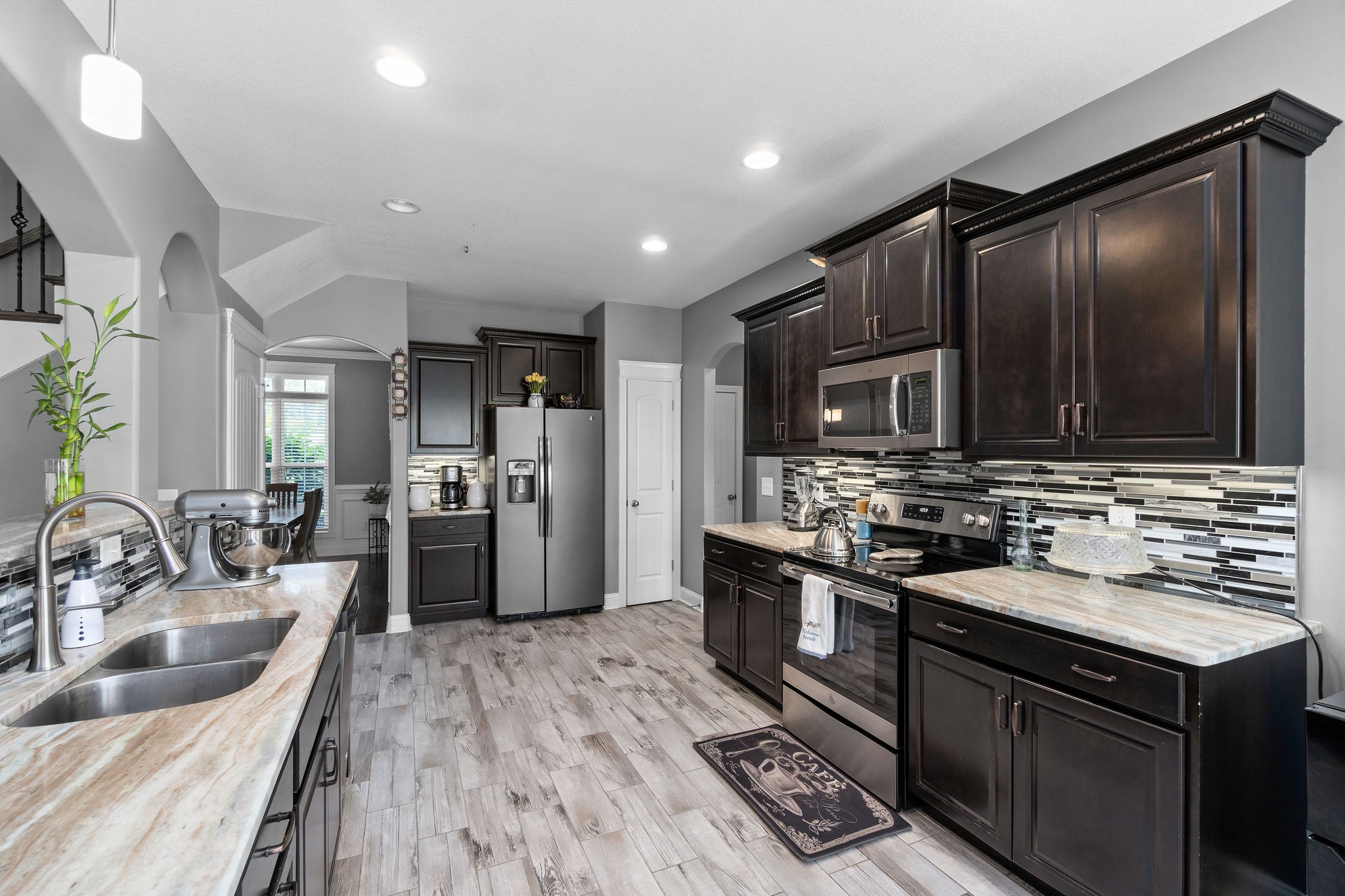 3508 Drake Road Adams, TN 37010 - Photo 13 of 35 a kitchen with stainless steel appliances granite countertop a sink stove and refrigerator