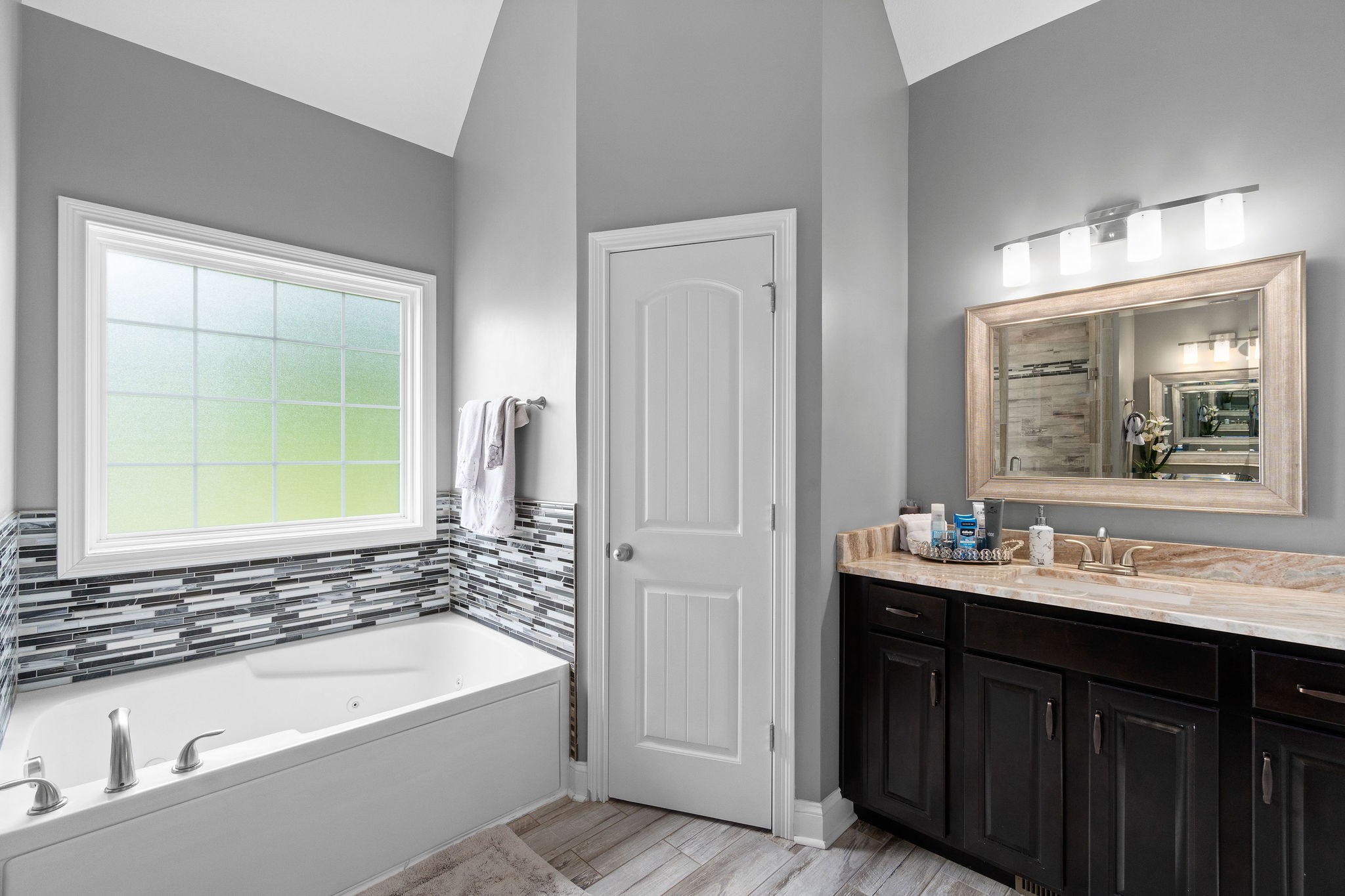 3508 Drake Road Adams, TN 37010 - Photo 22 of 35 a bathroom with a tub a sink and a window