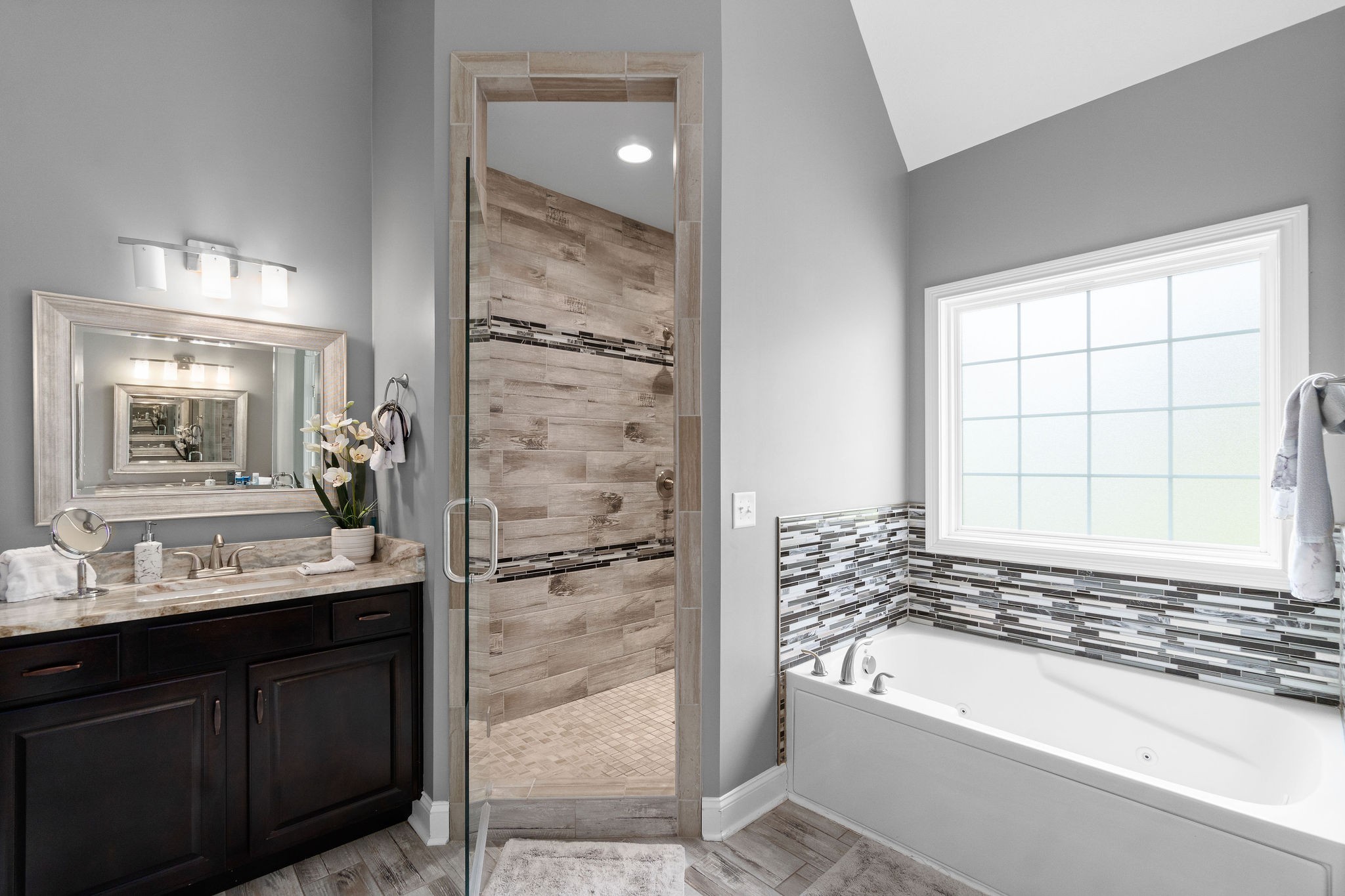 3508 Drake Road Adams, TN 37010 - Photo 23 of 35 a bathroom with a bathtub sink and mirror