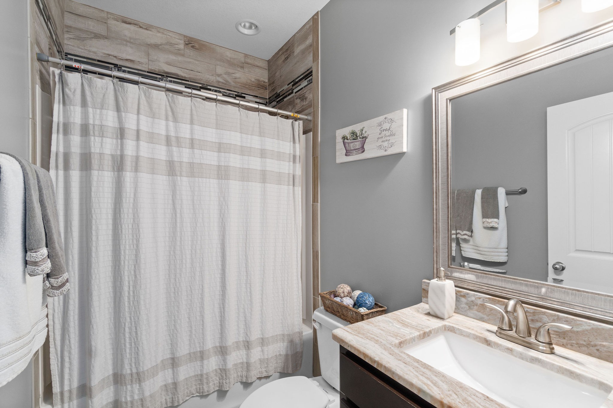 3508 Drake Road Adams, TN 37010 - Photo 25 of 35 a bathroom with a granite countertop sink and a mirror