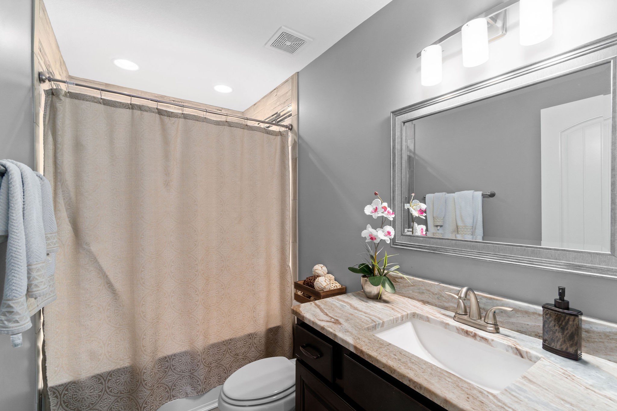3508 Drake Road Adams, TN 37010 - Photo 26 of 35 a bathroom with a granite countertop sink toilet and shower