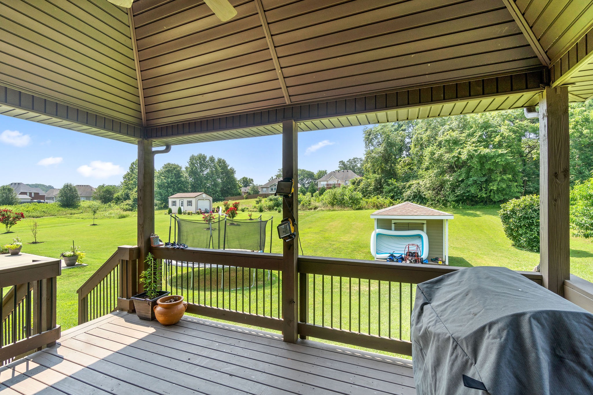 3508 Drake Road Adams, TN 37010 - Photo 33 of 35 a view of a deck with a table and chairs next to a yard