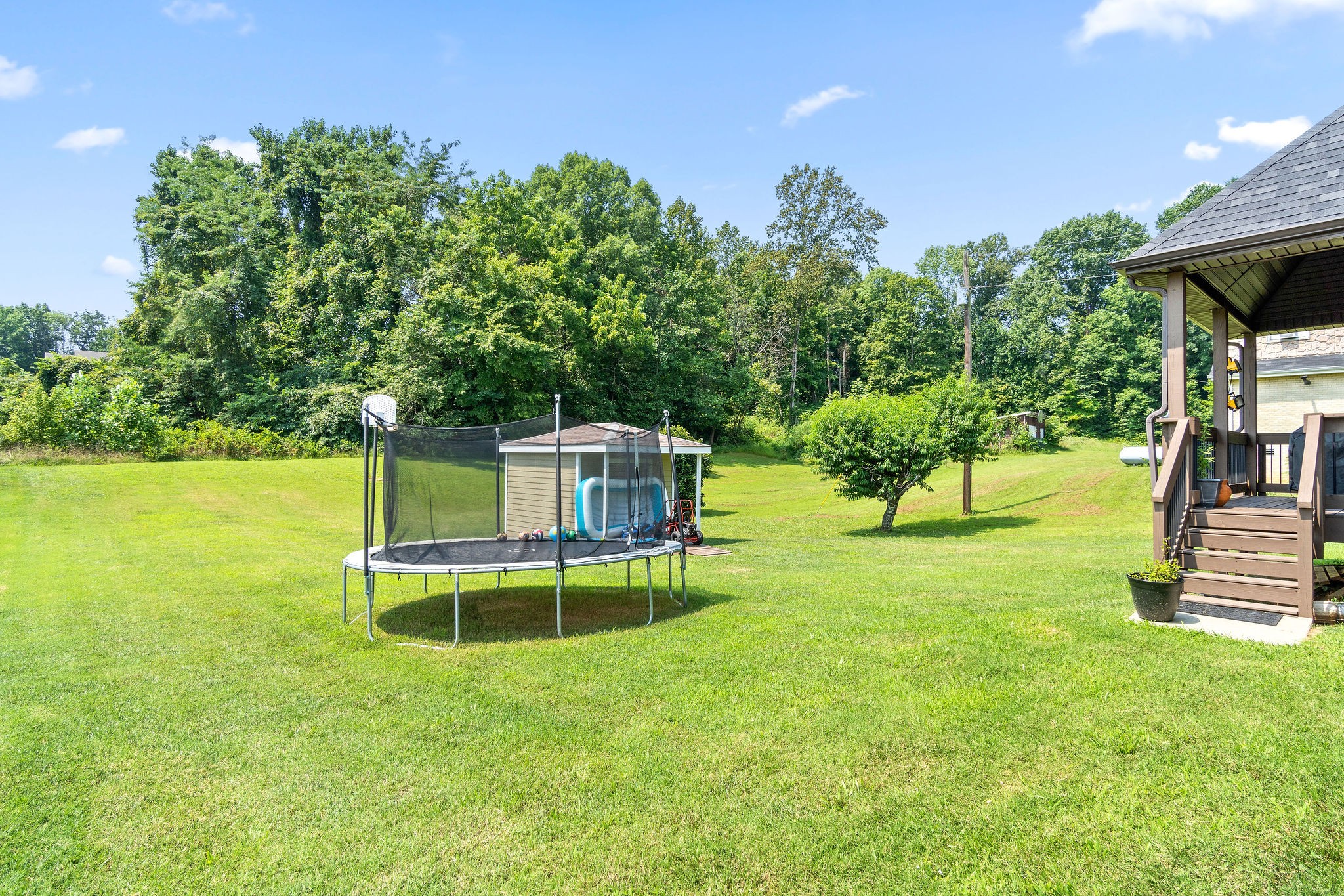 3508 Drake Road Adams, TN 37010 - Photo 34 of 35 a backyard of a house with table and chairs