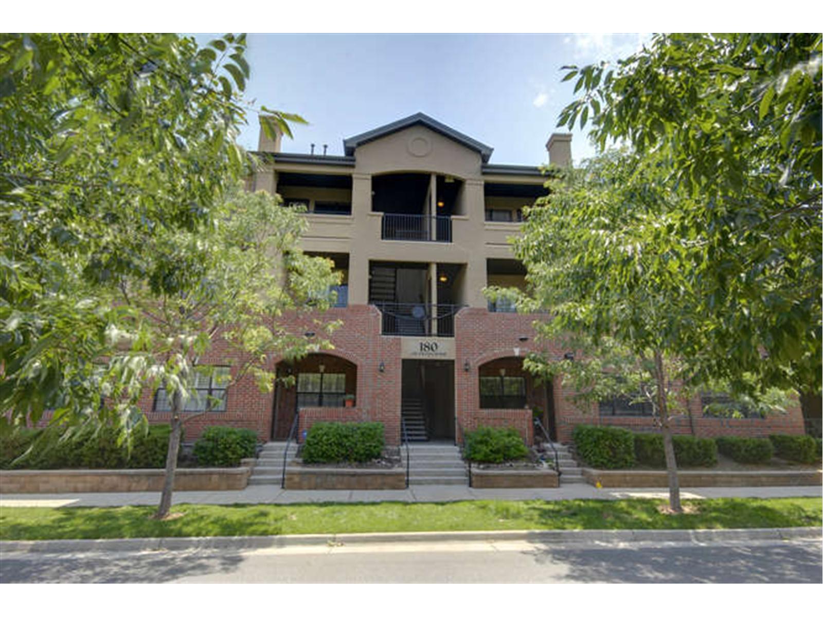 180 Poplar Street, Unit L Denver, CO 80220 - Photo 1 of 1 a front view of a house with a yard