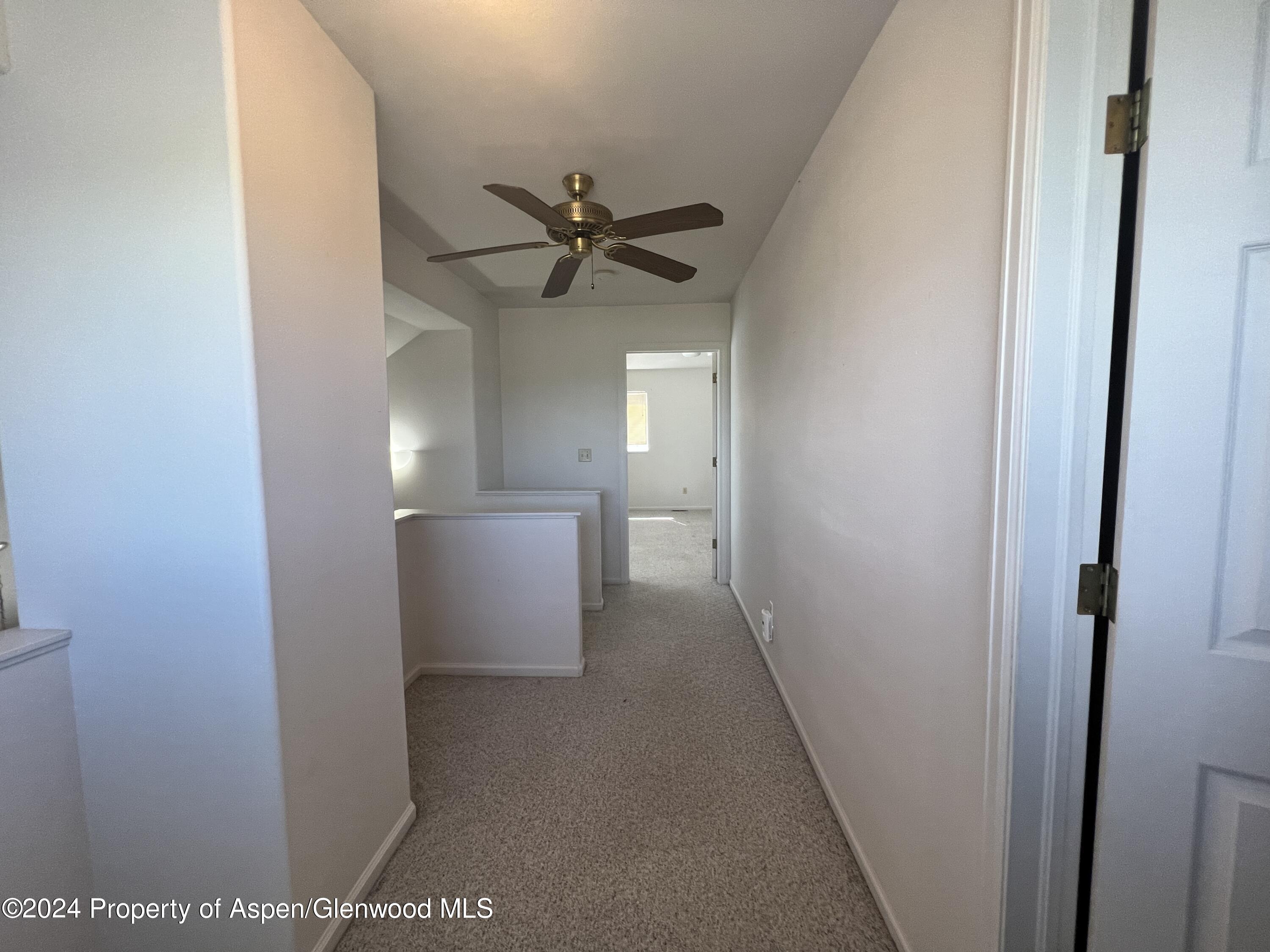 424 Lind Avenue Rifle, CO 81650 - Photo 15 of 24 a view of a hallway with a white walls