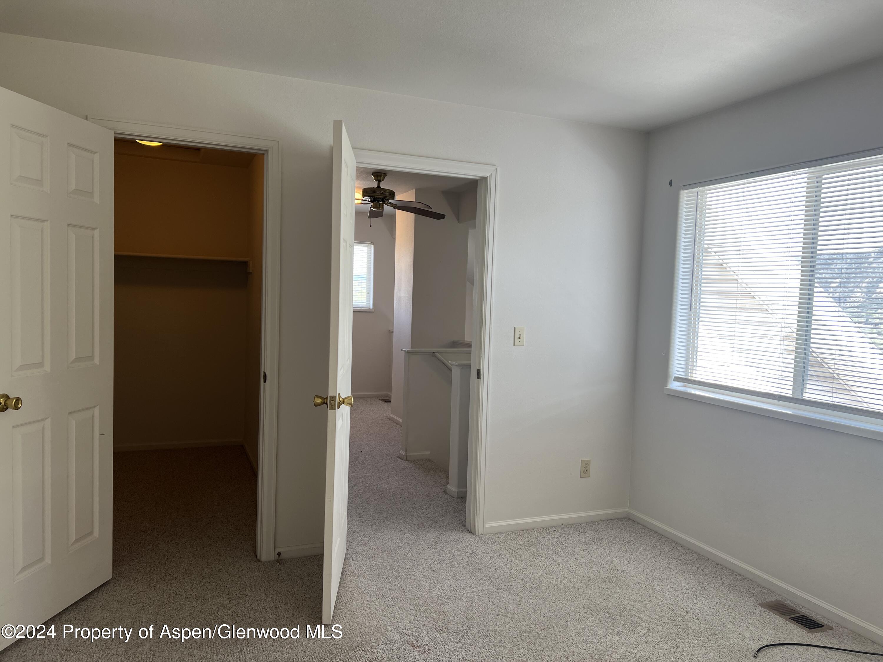 424 Lind Avenue Rifle, CO 81650 - Photo 17 of 24 a view of an empty room with a window