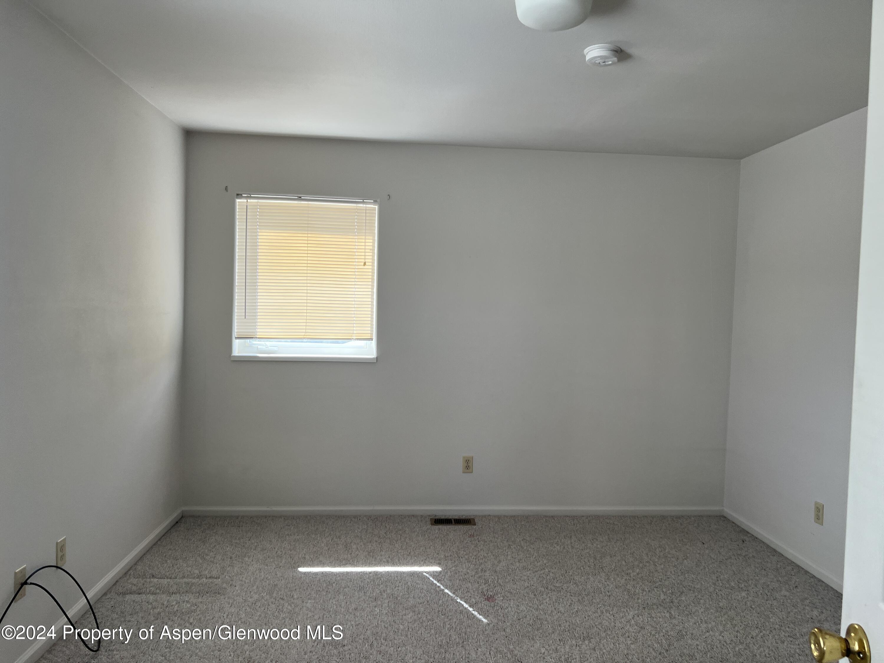 424 Lind Avenue Rifle, CO 81650 - Photo 18 of 24 an empty room with a window