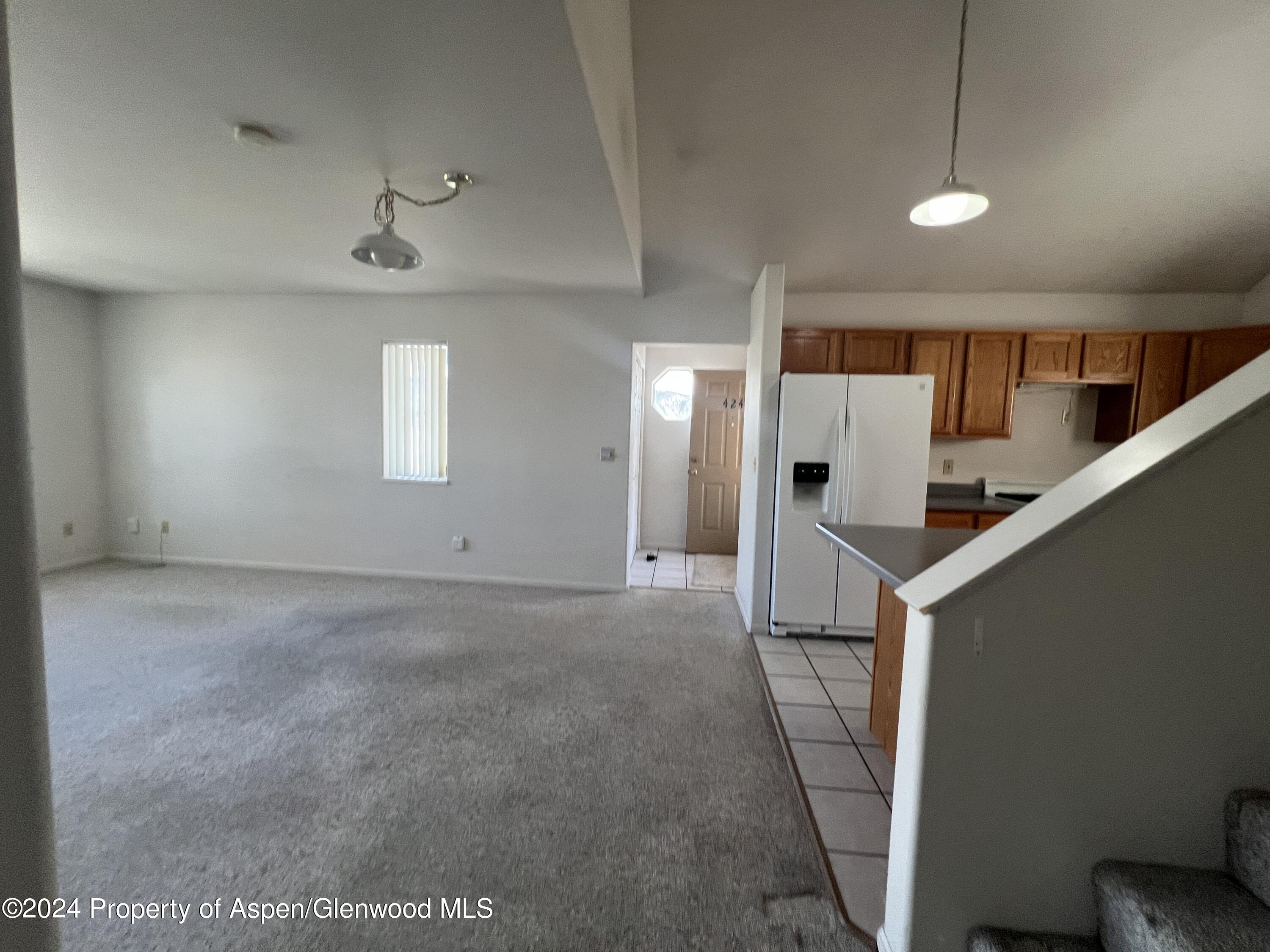 424 Lind Avenue Rifle, CO 81650 - Photo 24 of 24 a view of a hallway to of a house with stairs