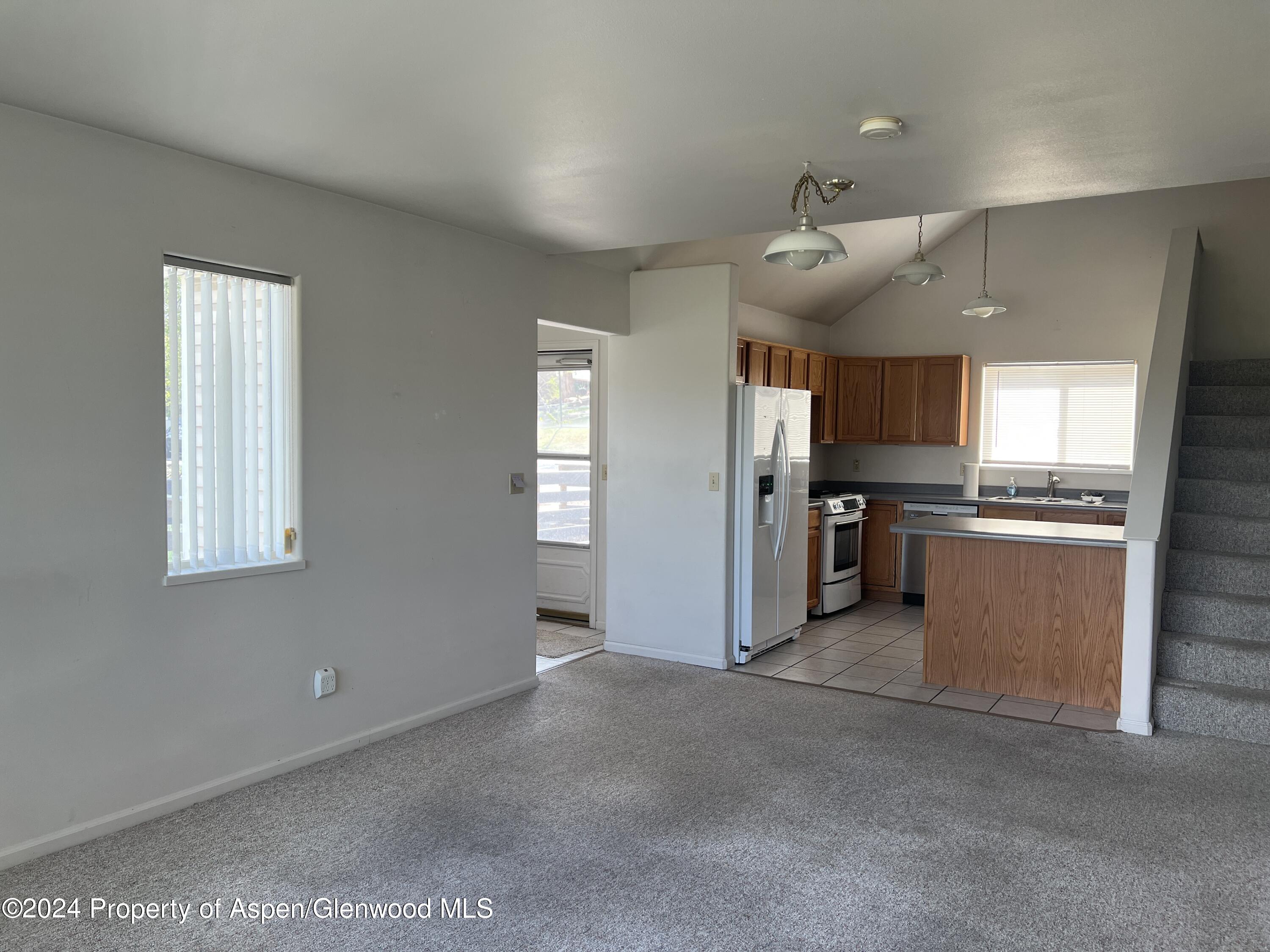 424 Lind Avenue Rifle, CO 81650 - Photo 3 of 24 a view of a kitchen with a sink cabinets and window