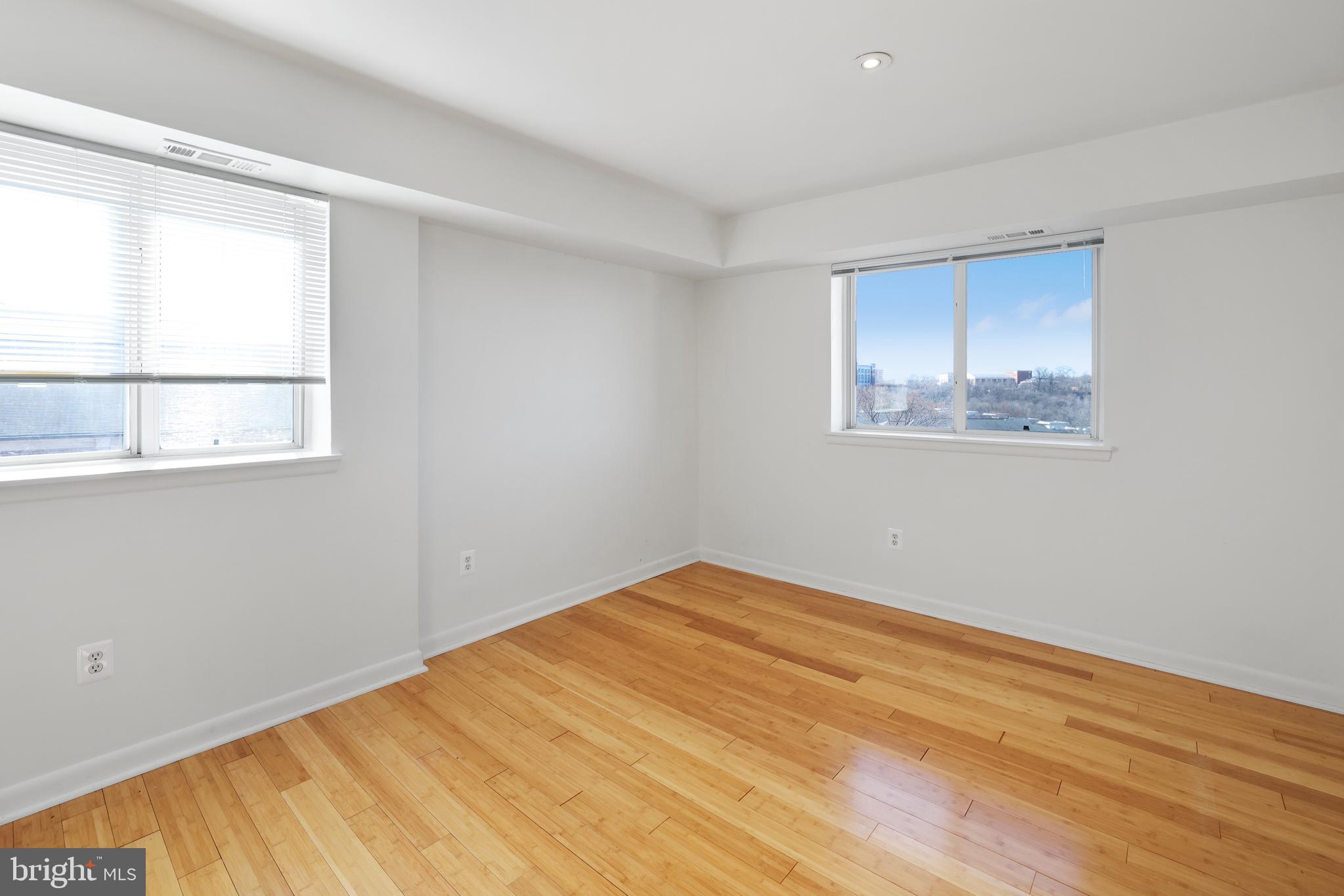 2634 Bowen Road Southeast, Unit 404 Washington, DC 20020 - Photo 12 of 15 a view of empty room with wooden floor and fan