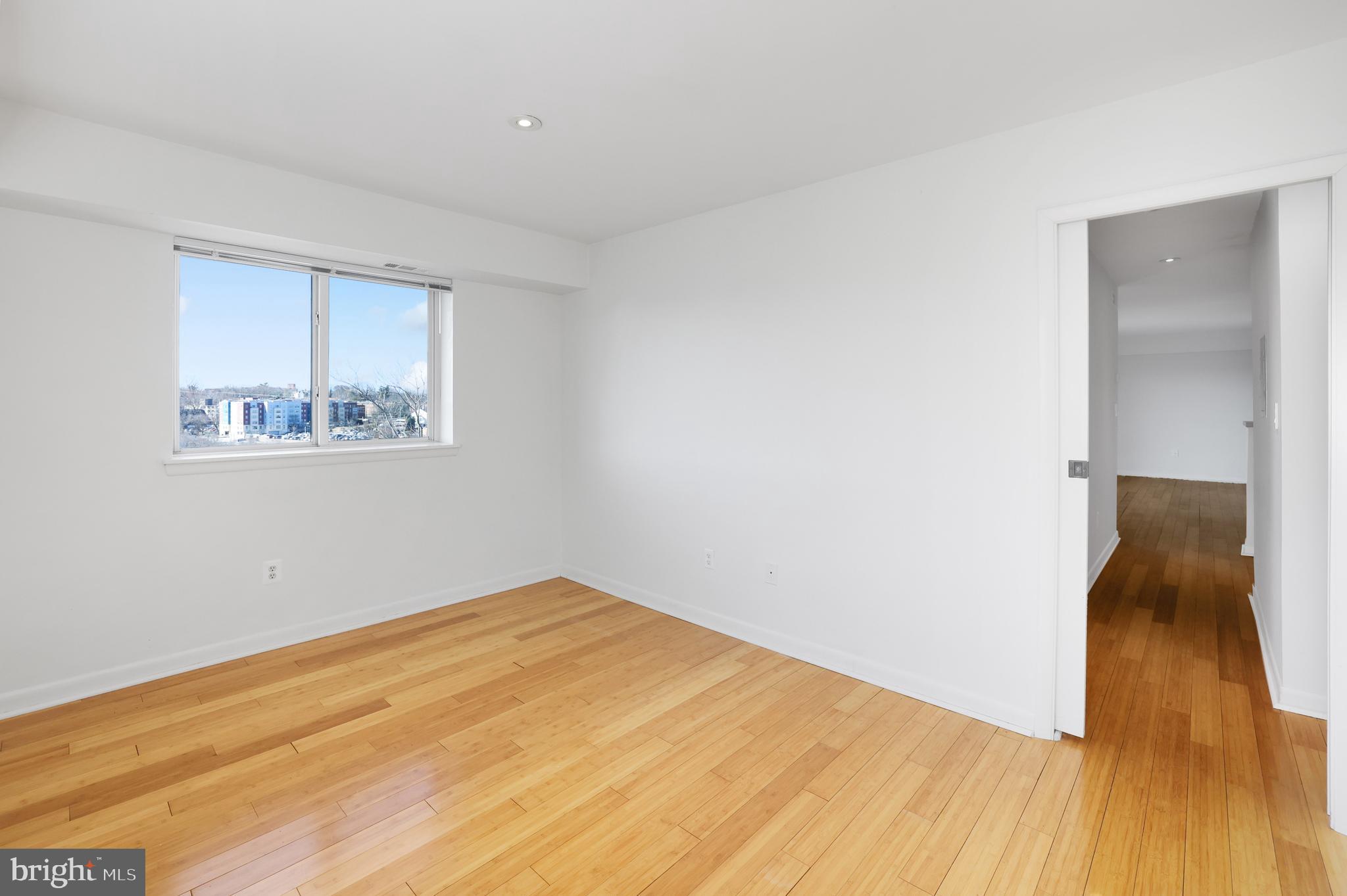 2634 Bowen Road Southeast, Unit 404 Washington, DC 20020 - Photo 15 of 15 a view of empty room with wooden floor