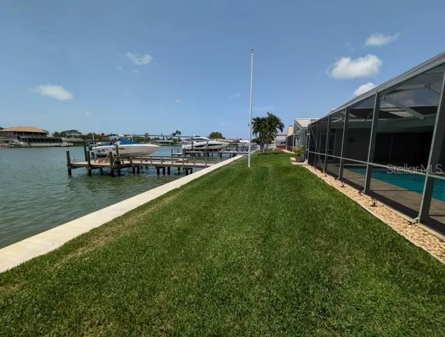 a view of a backyard with sitting area