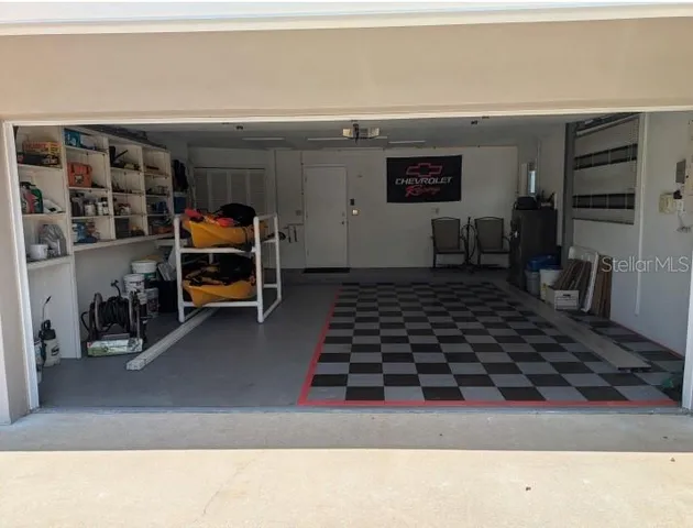 a kitchen with a refrigerator and a stove