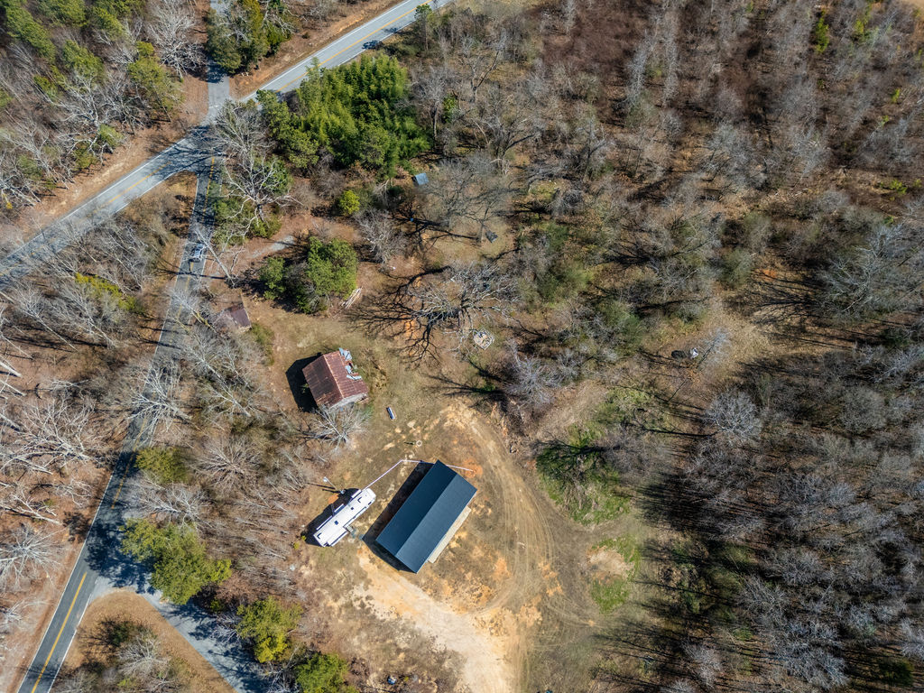 900 Asaville School Road Anderson, SC 29621 - Photo 15 of 29 An aerial view captures the vastness of this scenic, tree-lined property.