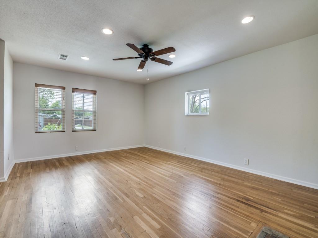 2315 Inadale Avenue Dallas, TX 75228 - Photo 11 of 36 a view of an empty room with wooden floor and a window