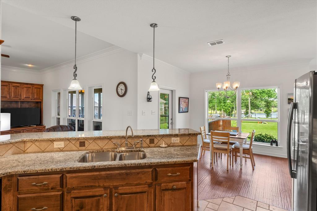 345 Rains County Road 3390 Emory, TX 75440 - Photo 15 of 39 a very nice looking kitchen with a large window and dining table