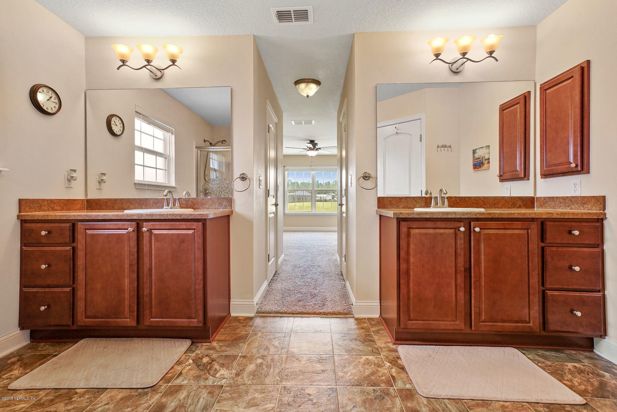 3007 Longleaf Ranch Circle Middleburg, FL 32068 - Photo 16 of 27 Master suite with dual sinks and closets