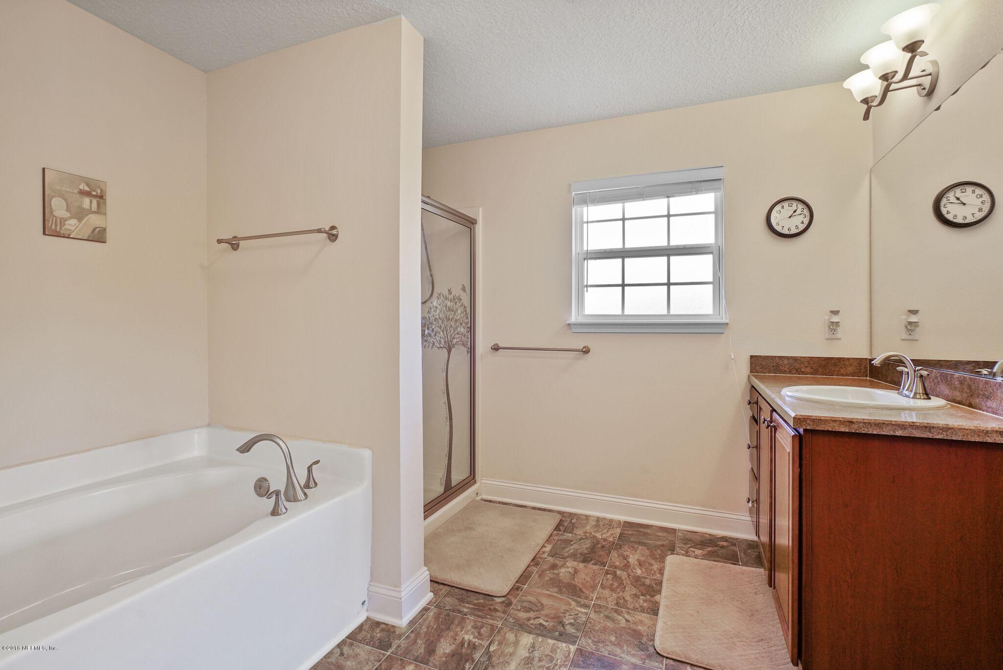 3007 Longleaf Ranch Circle Middleburg, FL 32068 - Photo 17 of 27 Master Bathroom with shower and a tub