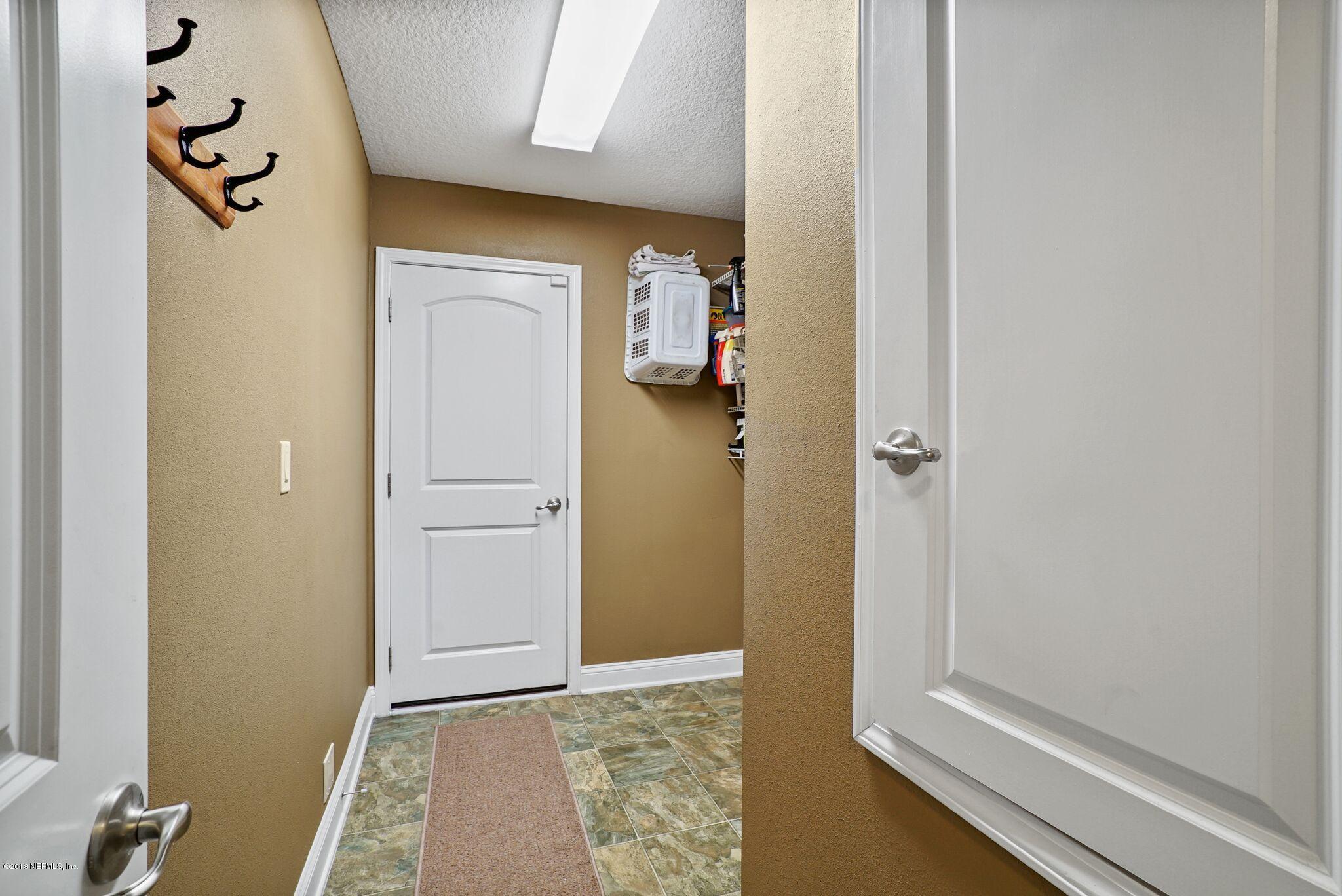 3007 Longleaf Ranch Circle Middleburg, FL 32068 - Photo 18 of 27 Laundry Room and door to 3 car garage