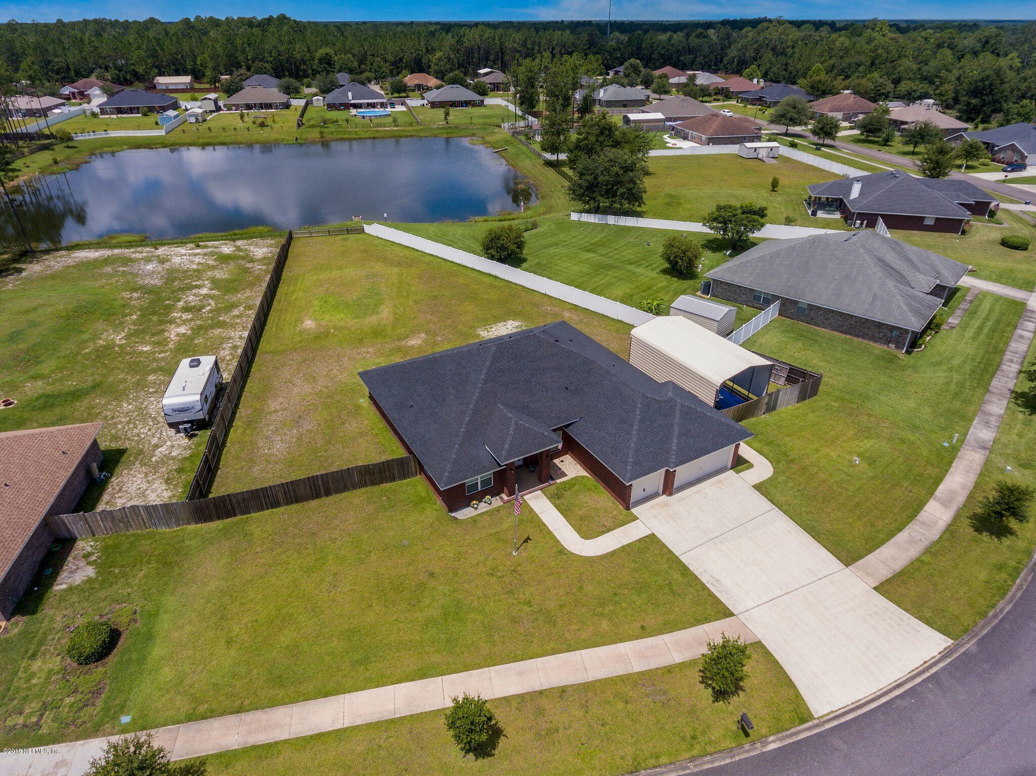 3007 Longleaf Ranch Circle Middleburg, FL 32068 - Photo 24 of 27 Almost an acre of land on a pond