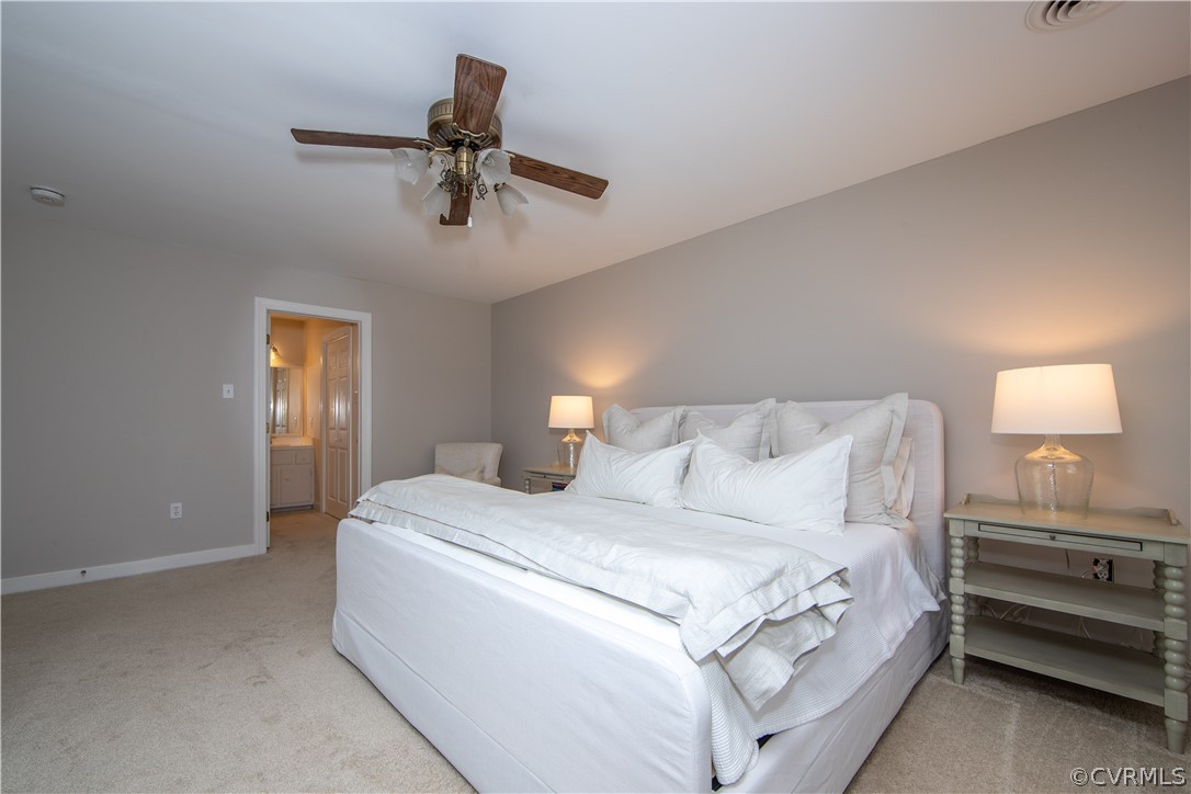2111 Corner Rock Road Midlothian, VA 23113 - Photo 20 of 35 a bedroom with a bed and a lamp