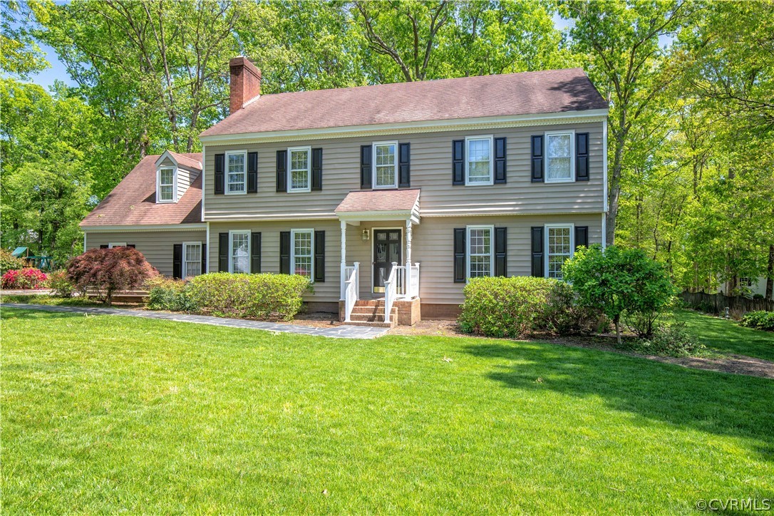2111 Corner Rock Road Midlothian, VA 23113 - Photo 2 of 35 a front view of a house with a garden