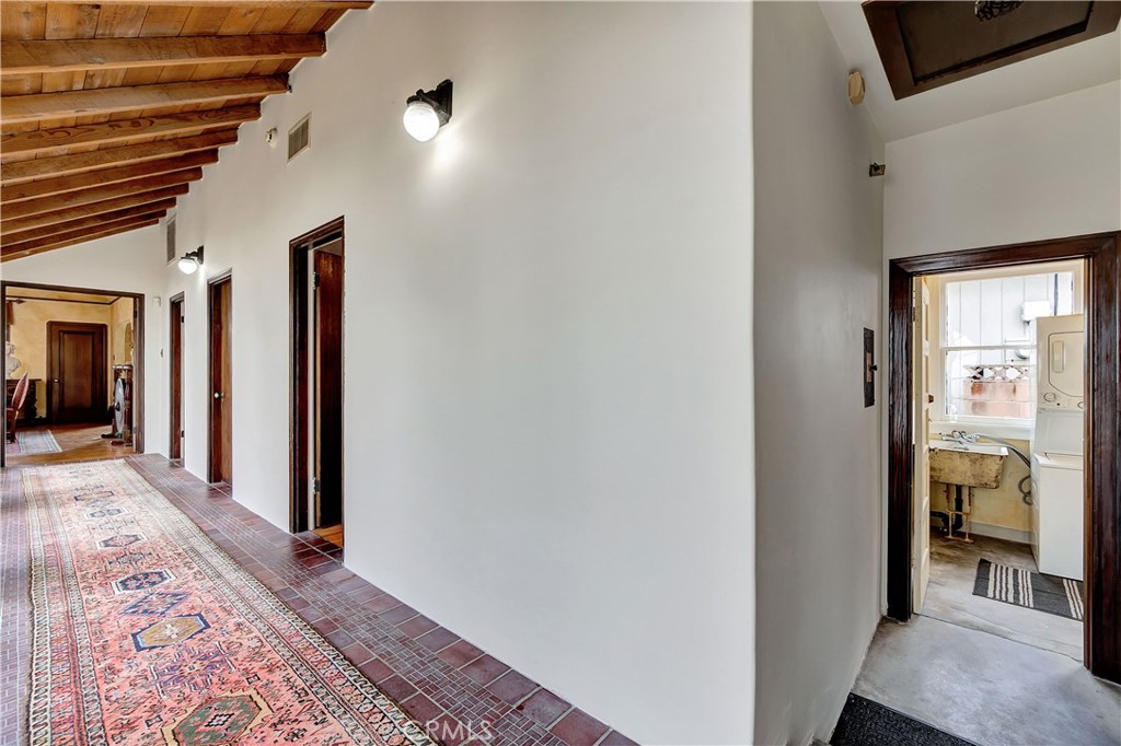 149 Siena Drive Long Beach, CA 90803 - Photo 22 of 40 a view of a hallway with wooden floor and a bathroom