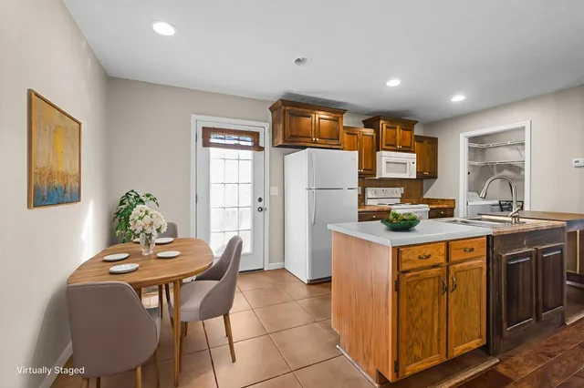 a kitchen with a sink cabinets and window