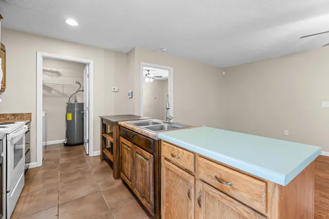 a kitchen with a stove and a refrigerator