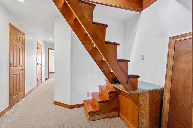 a large room with a large window and furniture