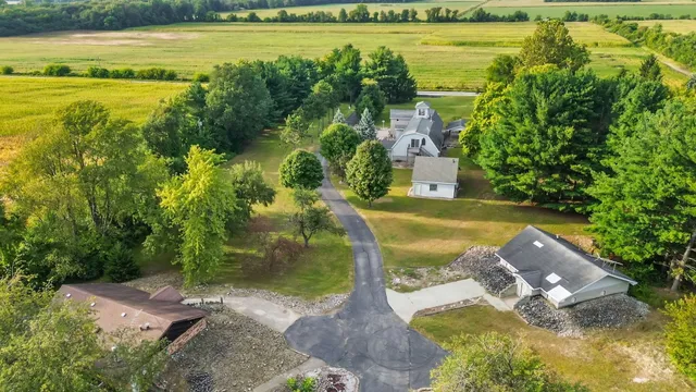 a view of a house with basketball court