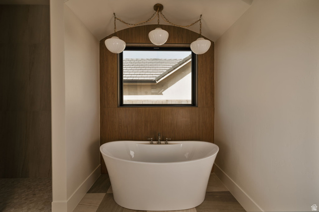 2281 South Crimson Cliffs Way St. George, UT 84790 - Photo 25 of 47 Primary bath featuring a freestanding tub and wood finished floors