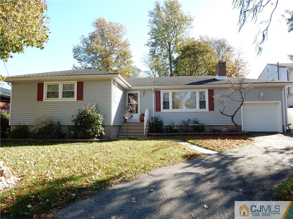 107 West Hill Road Colonia, NJ 07067 - Photo 2 of 16 a front view of a house with a yard
