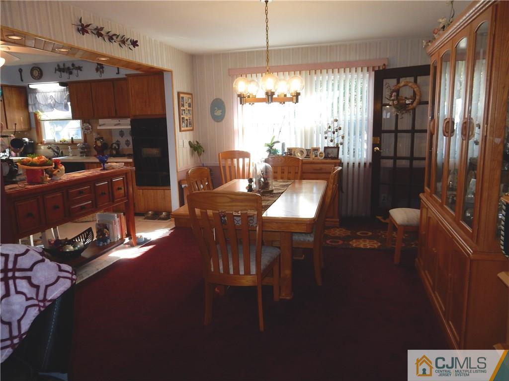 107 West Hill Road Colonia, NJ 07067 - Photo 8 of 16 a view of a dining room with furniture window and outside view