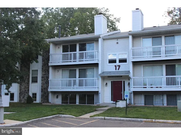 a view of building with a yard