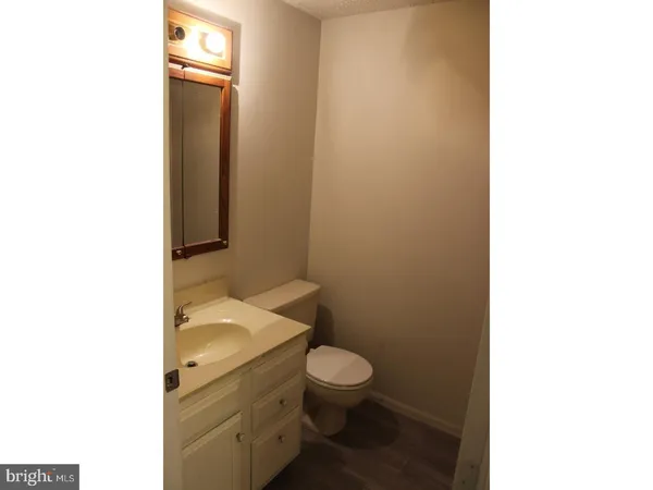 a bathroom with a toilet and a sink