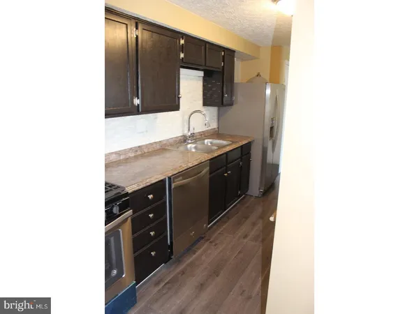 a bathroom with a double vanity sink and mirror