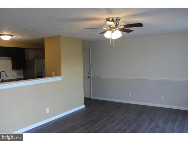 a view of a livingroom with a fan