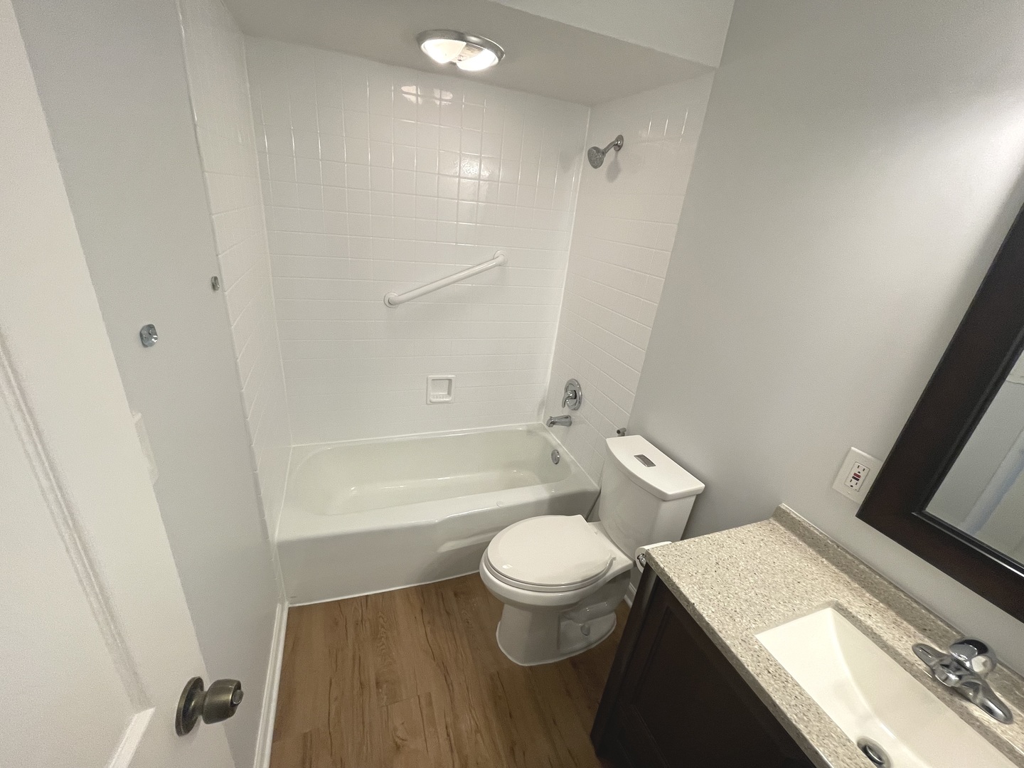 500 74th Street, Unit 102 Downers Grove, IL 60516 - Photo 13 of 21 a bathroom with a sink a toilet and shower