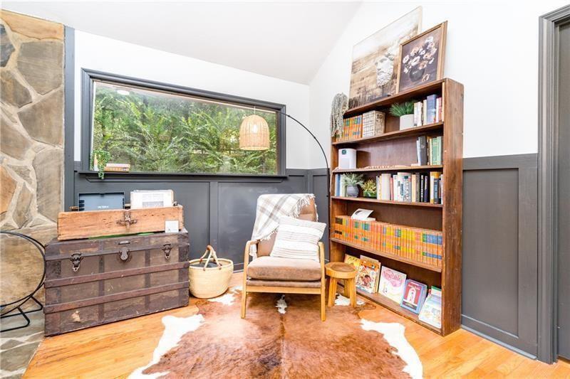 2889 Old Parker Pl Road Ellijay, GA 30536 - Photo 17 of 59 a living room with fireplace furniture and a book shelf