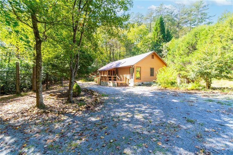 2889 Old Parker Pl Road Ellijay, GA 30536 - Photo 34 of 59 a view of house with backyard and trees