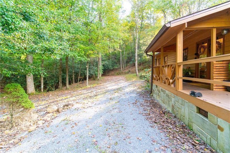 2889 Old Parker Pl Road Ellijay, GA 30536 - Photo 36 of 59 a backyard of a house with lots of green space